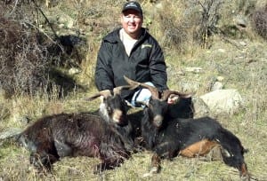 Eric with two running billy goats he took. 